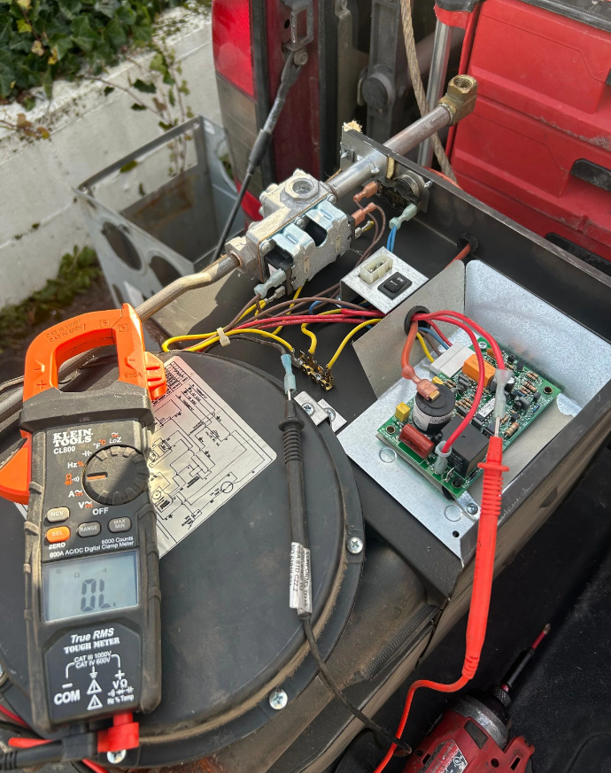 RV technician diagnosing a rooftop AC unit in Martin County